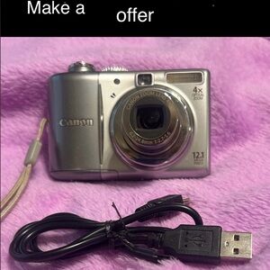 Canon Power Shot A1100 IS Silver Digital Camera with USB Connectivity.